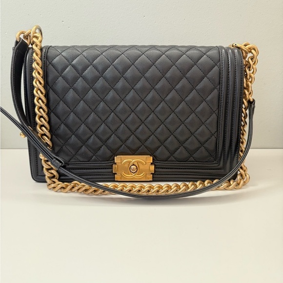 CHANEL Handbags - CHANEL Black Caviar Boy Bag with Aged Gold Chain and microchip